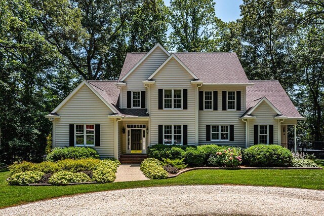 858 Harmony Hills Cir, Heathsville, VA 22473 - view of front facade featuring a shingled roof and a front yard