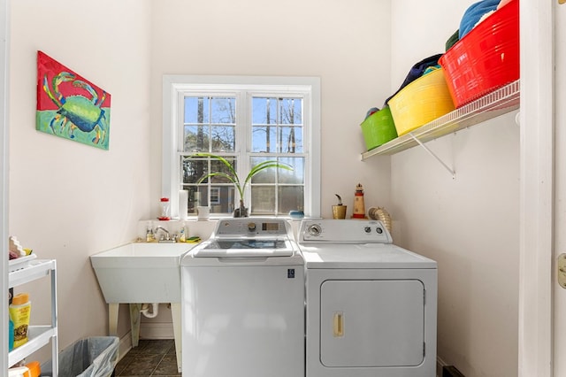 laundry area with laundry area and separate washer and dryer