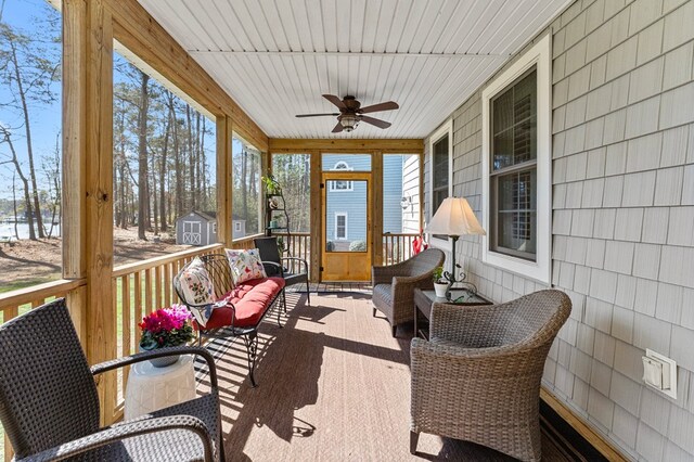 sunroom / solarium with ceiling fan