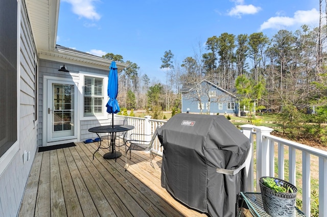 wooden deck featuring area for grilling