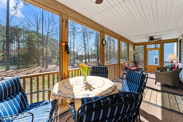 sunroom with a ceiling fan