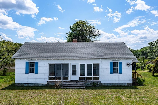 1021 Virmar Beach Rd, Heathsville, VA 22482 - back of house with a shingled roof, a lawn, and a chimney