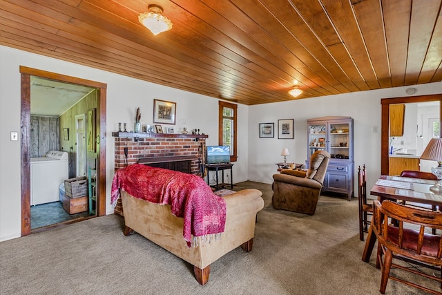 1021 Virmar Beach Rd, Heathsville, VA 22482 - carpeted living area with washer / dryer, wooden ceiling, a fireplace, healthy amount of natural light, and a sink