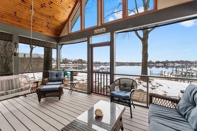 sunroom / solarium with wood ceiling, lofted ceiling, and a water view