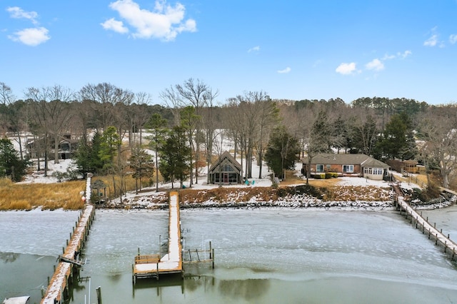 exterior space featuring a water view and a boat dock