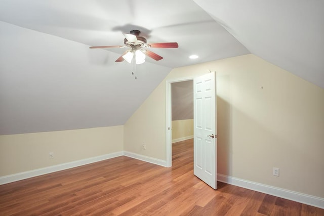 bonus room featuring light wood-type flooring, vaulted ceiling, and ceiling fan