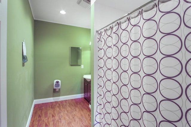 bathroom featuring hardwood / wood-style floors and vanity