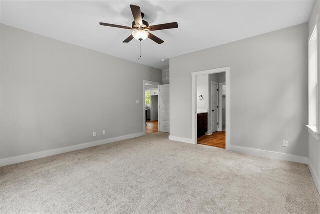 TBD Knights Landing Drive, Heathsville, VA 22473 - unfurnished bedroom featuring carpet flooring, baseboards, connected bathroom, and ceiling fan