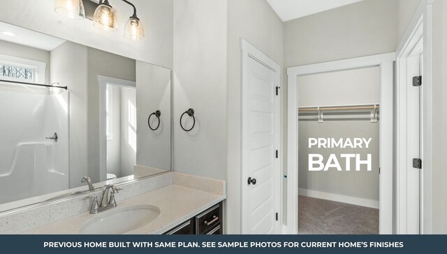 TBD Knights Landing Drive, Heathsville, VA 22473 - bathroom with vanity, baseboards, and a walk in closet