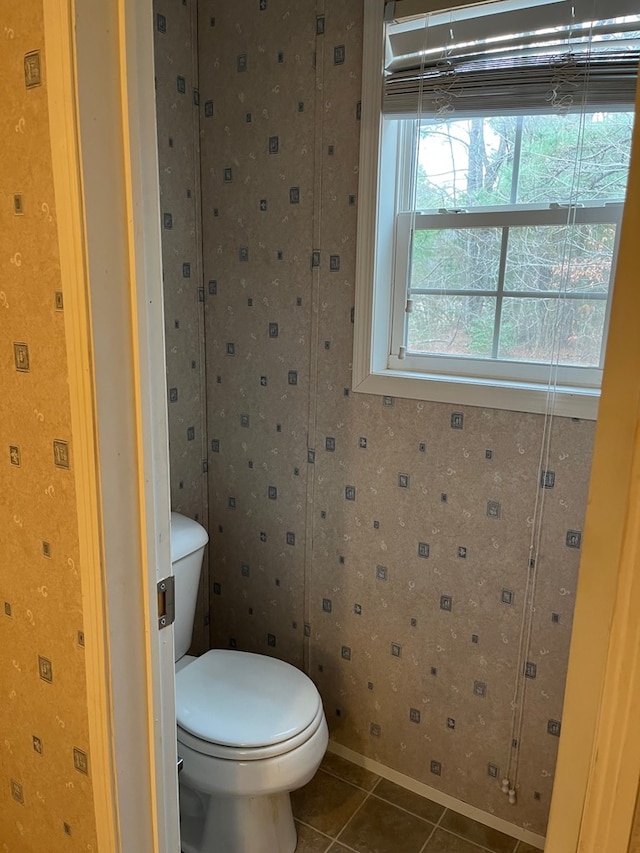 bathroom with tile patterned floors and toilet