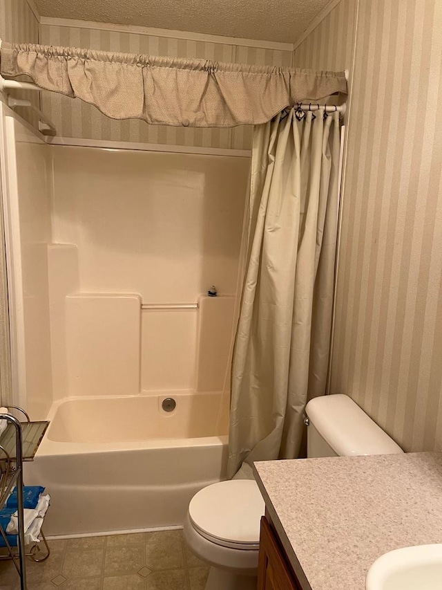 full bathroom featuring vanity, toilet, tile patterned floors, a textured ceiling, and shower / bath combo with shower curtain