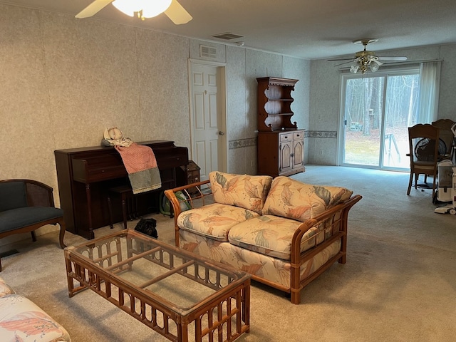 living room featuring light colored carpet and ceiling fan