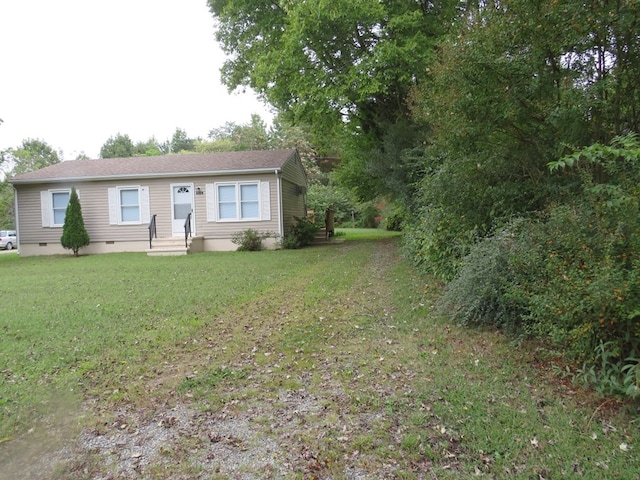 ranch-style house featuring a front yard