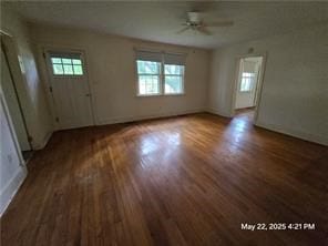 300 Irvington Rd, Kilmarnock, VA 22482 - unfurnished living room with ceiling fan, wood finished floors, and baseboards