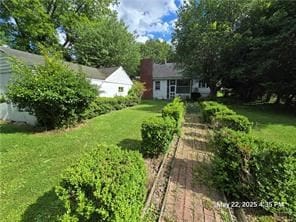 300 Irvington Rd, Kilmarnock, VA 22482 - view of green lawn with a garden
