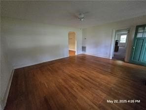300 Irvington Rd, Kilmarnock, VA 22482 - spare room featuring wood finished floors, arched walkways, and baseboards