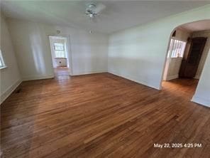 300 Irvington Rd, Kilmarnock, VA 22482 - unfurnished room with arched walkways, wood finished floors, and baseboards