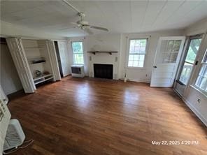 300 Irvington Rd, Kilmarnock, VA 22482 - unfurnished living room with ceiling fan, a fireplace, wood finished floors, and plenty of natural light
