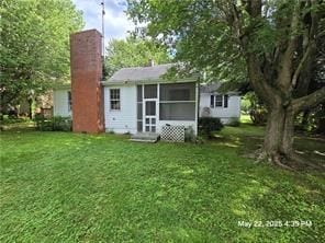 300 Irvington Rd, Kilmarnock, VA 22482 - rear view of property featuring a yard and a chimney