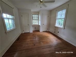 300 Irvington Rd, Kilmarnock, VA 22482 - unfurnished bedroom featuring multiple windows, wood finished floors, and baseboards
