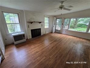 300 Irvington Rd, Kilmarnock, VA 22482 - unfurnished living room with ceiling fan, wood finished floors, and a fireplace