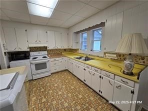 300 Irvington Rd, Kilmarnock, VA 22482 - kitchen featuring electric range, extractor fan, tile patterned floors, a sink, and a paneled ceiling