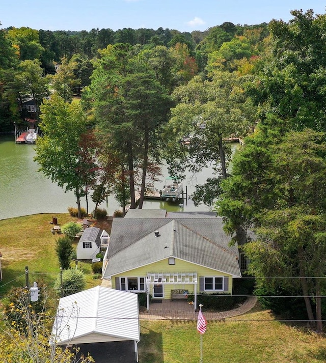 birds eye view of property with a water view