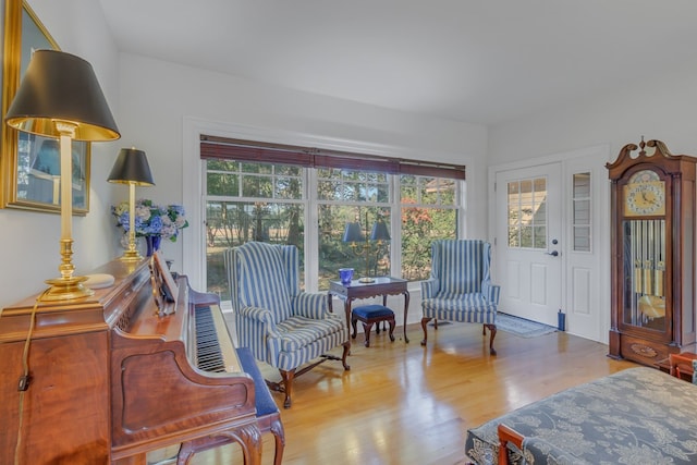 sitting room with light hardwood / wood-style flooring and french doors