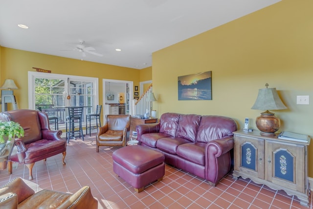 tiled living room with ceiling fan