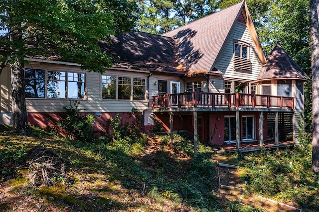 rear view of house featuring a deck