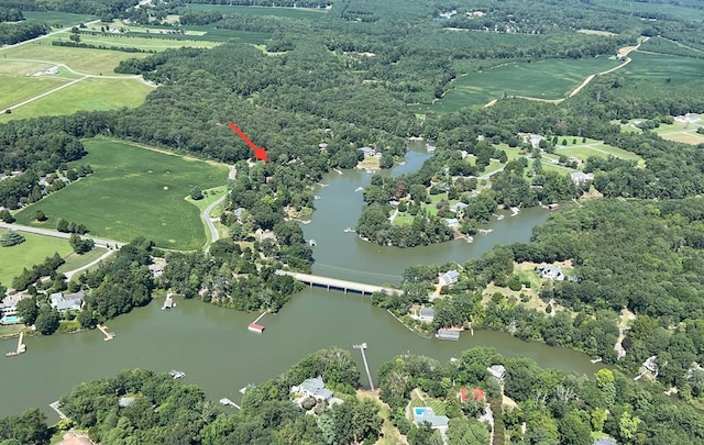 birds eye view of property featuring a water view