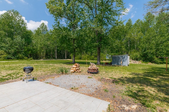 274 Regina Rd, Lancaster, VA 22503 - view of green lawn with a patio, a storage unit, and an outbuilding