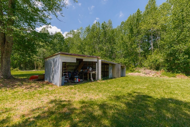 274 Regina Rd, Lancaster, VA 22503 - view of pole building featuring a yard and a wooded view