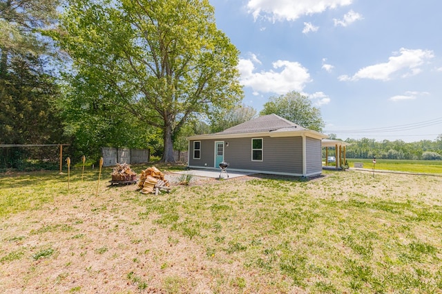 274 Regina Rd, Lancaster, VA 22503 - rear view of property with a fire pit and a patio area