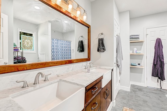 274 Regina Rd, Lancaster, VA 22503 - full bath with wood finished floors, double vanity, and baseboards