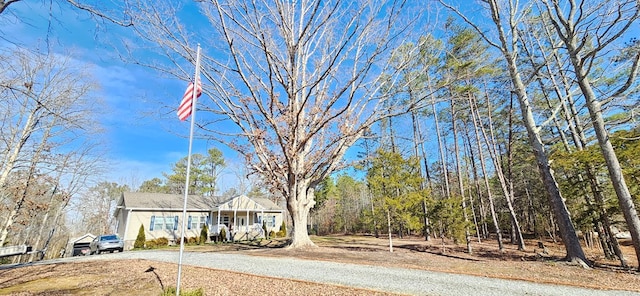 view of yard with covered porch