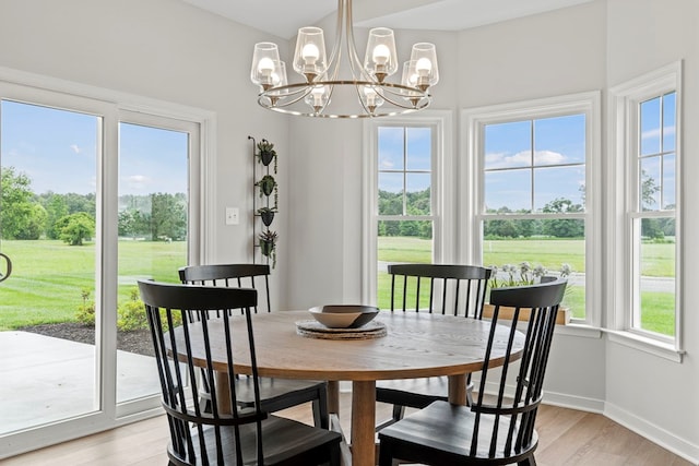 dining room featuring a chandelier and light hardwood / wood-style floors