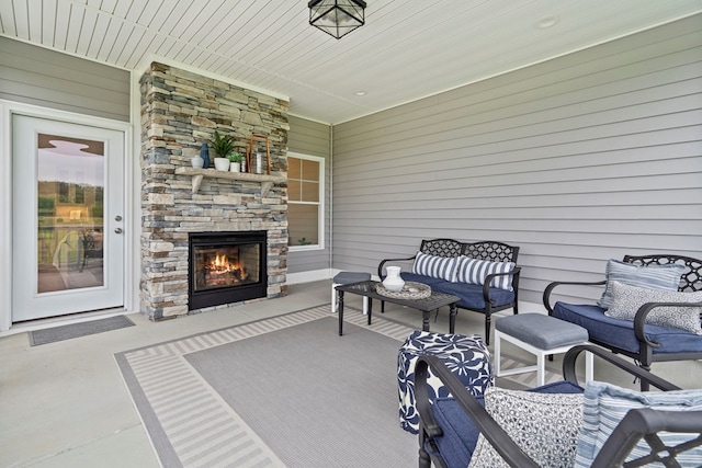 view of patio / terrace with an outdoor stone fireplace