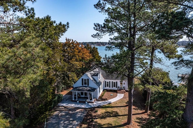 birds eye view of property featuring a water view