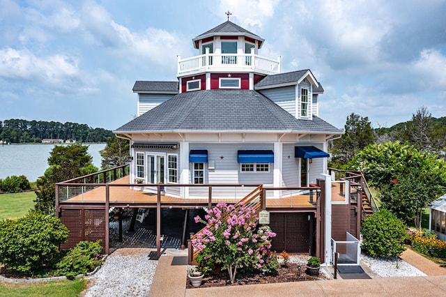 744 Possum Point Prt, Haywood, VA 23138 - victorian home featuring stairway, a deck with water view, and roof with shingles