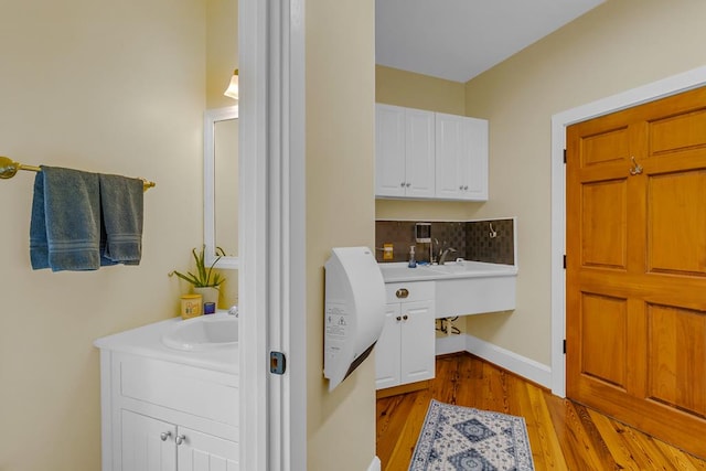 744 Possum Point Prt, Haywood, VA 23138 - washroom with light wood-style flooring and a sink