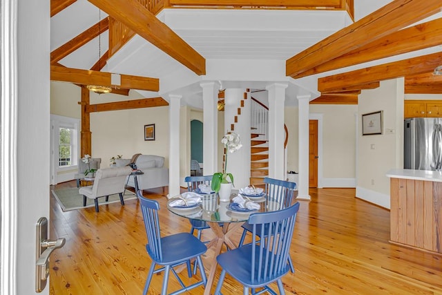 744 Possum Point Prt, Haywood, VA 23138 - dining area featuring beamed ceiling, decorative columns, light wood-style floors, and stairway