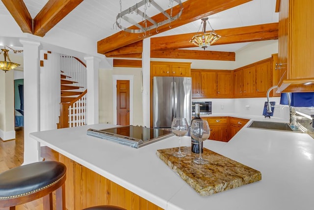 744 Possum Point Prt, Haywood, VA 23138 - kitchen featuring freestanding refrigerator, light countertops, brown cabinetry, and cooktop