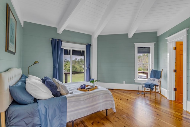 744 Possum Point Prt, Haywood, VA 23138 - bedroom with beamed ceiling, wood finished floors, access to outside, and wood walls