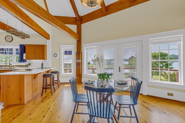 744 Possum Point Prt, Haywood, VA 23138 - dining space with beamed ceiling, light wood-style floors, and high vaulted ceiling