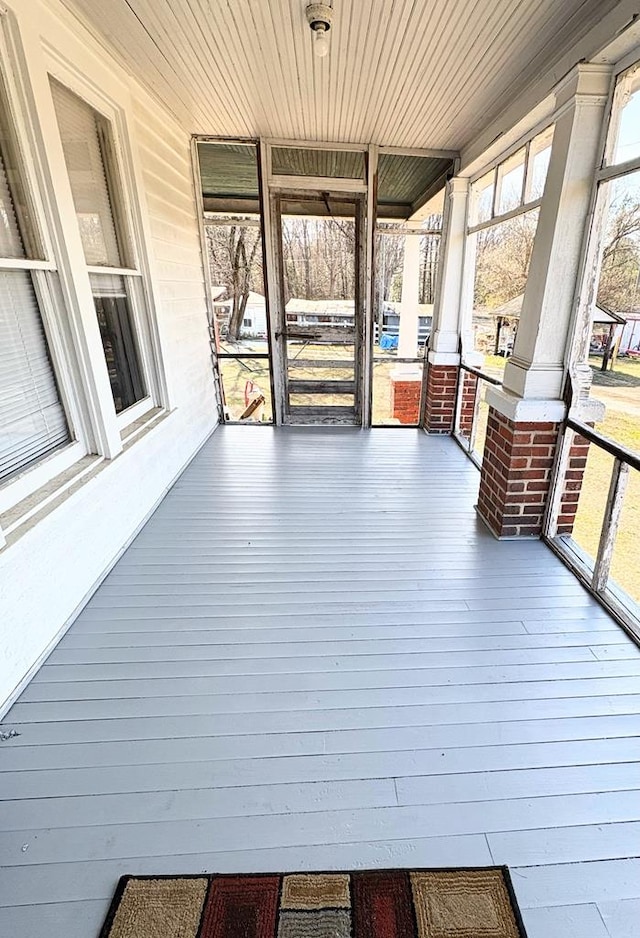 wooden terrace with a porch