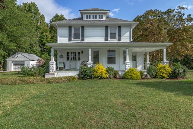 view of front of property featuring a front lawn, covered porch, and an outdoor structure