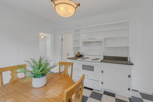 kitchen with electric range, white cabinets, and range hood