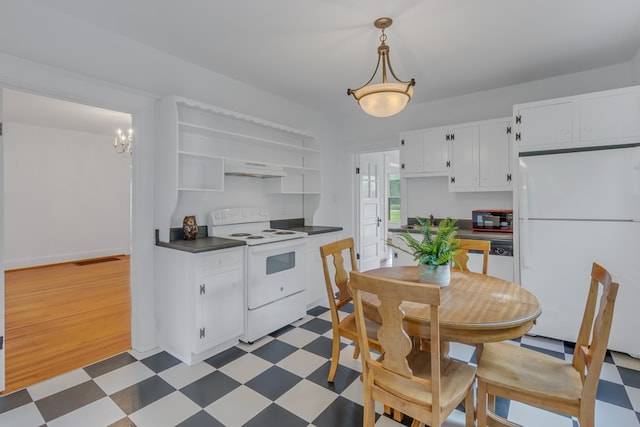 kitchen featuring pendant lighting, white appliances, exhaust hood, white cabinets, and a chandelier