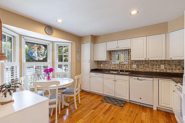 30 Heatherfield Ct, Kilmarnock, VA 22482 - kitchen with dishwasher, plenty of natural light, backsplash, light wood finished floors, and recessed lighting